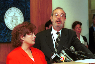 RIAA president Hilary Rosen and attorney Russell Frackman answer questions in a Los Angeles courthouse.